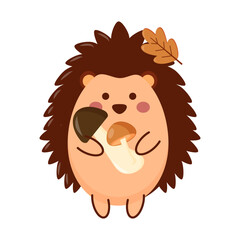 A cute cartoon hedgehog holds two mushrooms and has an autumn leaf on its head. The hedgehog has a round body and a friendly expression