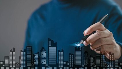 A person draws a city skyline with a pen, highlighting the buildings in a modern and creative design.
