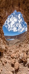 Cave opening reveals volcanic crater lake and sky