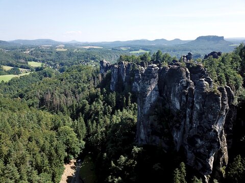 A drone photo taken from above showing Ferdinandstein and Bastei Bridge in Saxon Switzerland National Park