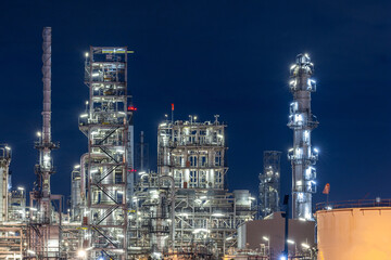 Oil and gas refinery plant at night, Global business energy logistic transportation, Oil and gas refinery petrochemical industrial, Petrochemical refinery industrial energy supply chain.