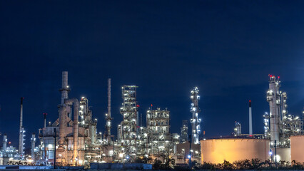 Oil and gas refinery plant at night, Global business energy logistic transportation, Oil and gas refinery petrochemical industrial, Petrochemical refinery industrial energy supply chain.