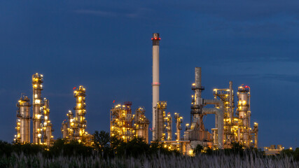 Oil and gas refinery plant at night, Global business energy logistic transportation, Oil and gas refinery petrochemical industrial, Petrochemical refinery industrial energy supply chain.