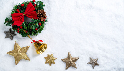a festive arrangement lies on a bed of fresh, white material