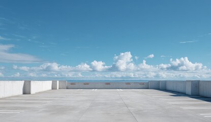 Empty rooftop terrace with a smooth concrete , overlooking a city skyline under a bright blue sky with scattered clouds