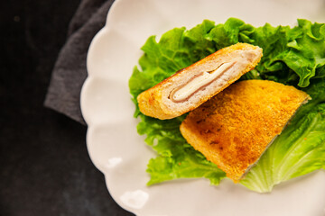 Cutlet cordon bleu meat chicken, cheese, ham second course french cuisine tasty snack fresh delicious gourmet food background on the table rustic food top view copy space