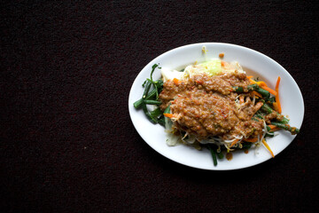 Pecel, a delicious Javanese traditional food, with vegetables served on a white plate