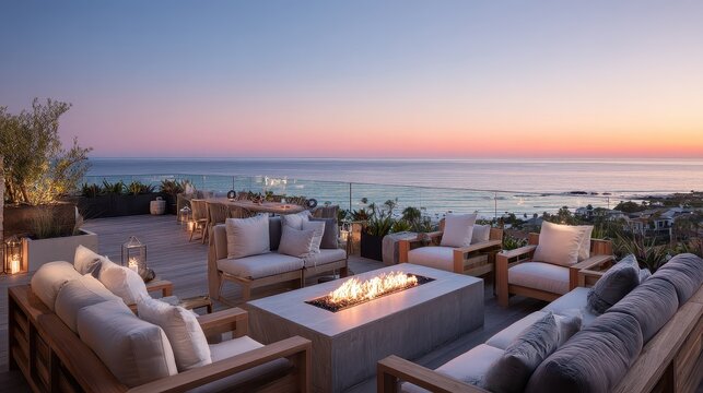 A fire pit on a deck overlooking the ocean