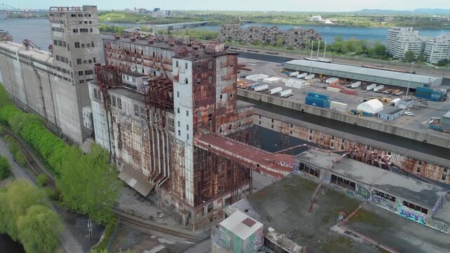 Aerial view of abandoned grain elevators in Lachine Canal National Historic Site., Montreal, Canada. The derelict industrial buildings stand as a reminder of the city's past as a major port.