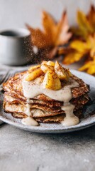 Enjoying a stack of golden crepes layered with sweet, caramelized apples sprinkled with cinnamon. The dish is drizzled with a creamy sauce and adorned with autumn leaves in the background