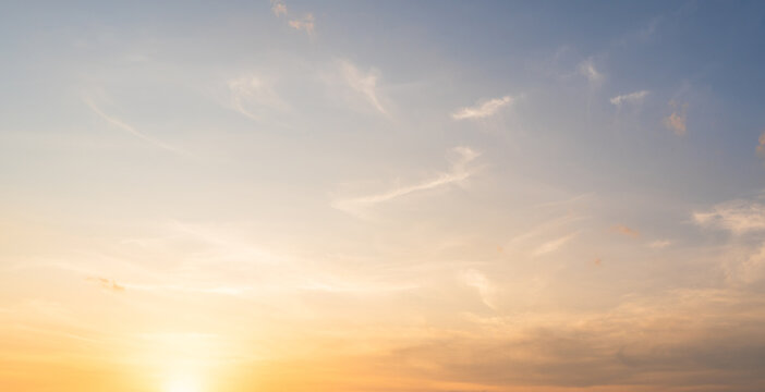 Golden Sky, Sunset sky cloud in Autumn Evening with Orange, Yellow, Blue sunlight, Horizon nature Golden hour Warm morning sunrise sky Background