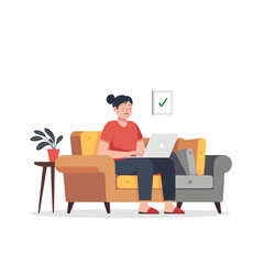 Beauty Girl Sitting on a Sofa Working on a Laptop