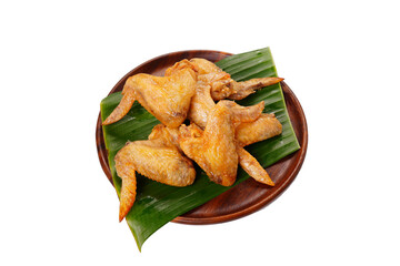 Chicken wings, grilled and cooked in a wooden tray food on a white