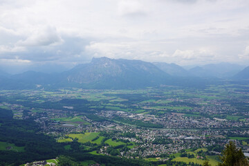Fototapeta premium The panorama of Salzburg and the Untersberg mountain ridge from Gaisberg mountain, Austria