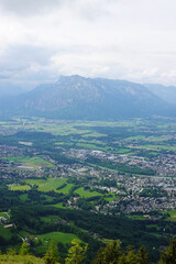 Fototapeta premium The panorama of Salzburg and the Untersberg mountain ridge from Gaisberg mountain, Austria