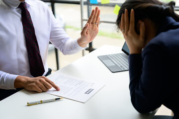 Employer rejecting job applicant during interview for a position in company office