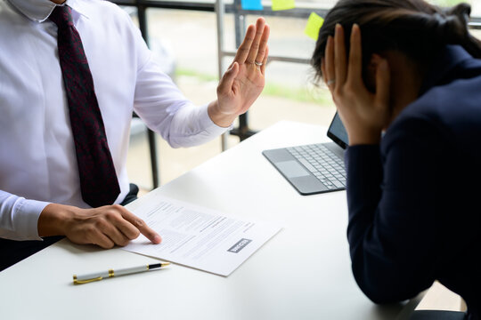 Employer rejecting job applicant during interview for a position in company office - Powered by Adobe