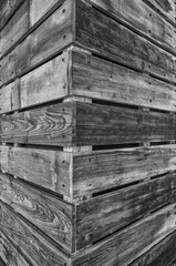 Abstract Closeup Background of an old Wooden Corner Wall in Black and White with Texture and Detail.