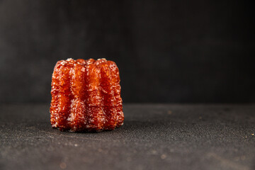 Canneles sweet dessert french cuisine sweets fresh delicious gourmet food background on the table...