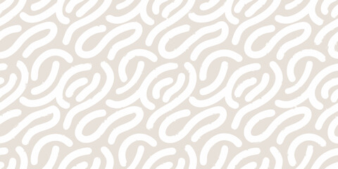 Abstract white brush strokes on a beige background pattern