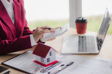 Businessman shakes hands with real estate agent during the signing of a real estate sales contract, concluding a successful real estate investment and mortgage deal.