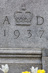 Ottawa, Ontario, Canada. May 20, 2024: Close-up of the 1937 inscription and crown emblem on the historic Bank of Canada building exterior in Ottawa.