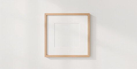 Square wooden frame mockup hanging on a white wall, perfect for showcasing your artwork or photography, creating a modern and minimalist interior design element isolated on white background mockup