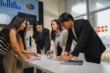 Business team analyzing financial charts and graphs, developing growth strategy