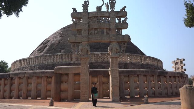 Woman tourist visit to the Sanchi Stupa, UNESCO World Heritage Site, Madhya Pradesh, India.