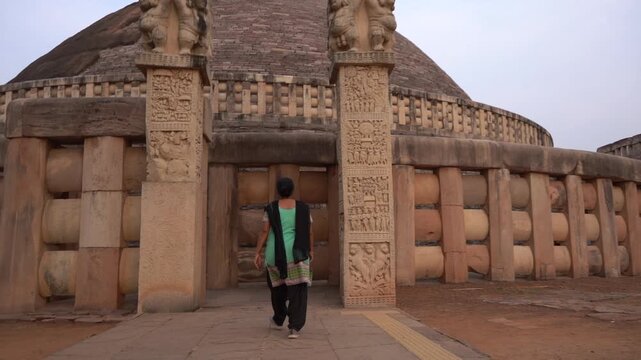 Woman tourist visit to the Sanchi Stupa, UNESCO World Heritage Site, Madhya Pradesh, India.