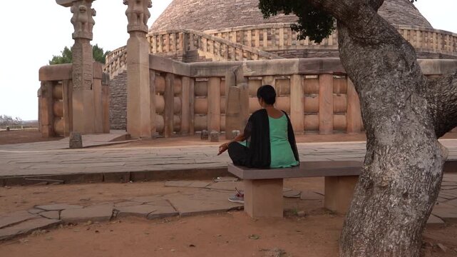 Woman tourist visit to the Sanchi Stupa, UNESCO World Heritage Site, Madhya Pradesh, India.