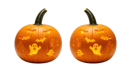 Two carved pumpkins with bats, spiders and ghosts on a black background