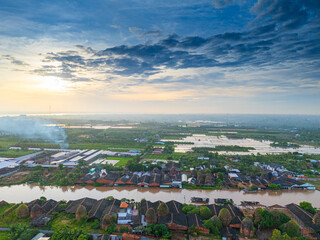 Naklejka premium Aerial view of Mang Thit brick kiln in Vinh Long. Burnt clay bricks used in traditional construction of Vietnamese. Mekong Delta, Vinh Long, Vietnam