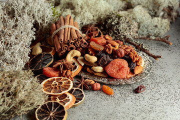Dried fruits and nuts on a silver try.