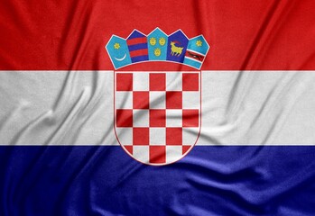 tricolor flag of the European country Croatia with a beautiful coat of arms on a rough canvas with...
