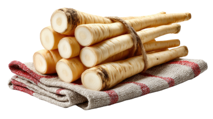 Parsley Root: A collection of fresh, white parsley root tied together, elegantly displayed on a rustic cloth, highlighting the ingredient's natural simplicity.