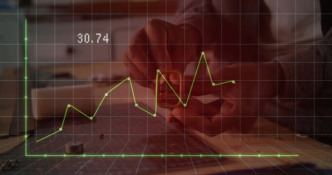 Man in plaid shirt measuring component using caliper on cutting mat in workshop, with grid overlay