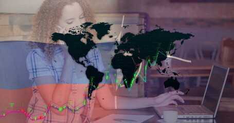 Woman wearing plaid shirt making smartphone call, typing laptop in cafe with notepad pen coffee cup