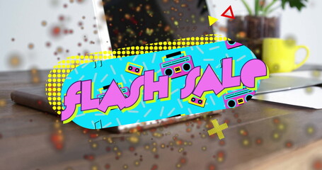 Floating promotional banner displaying FLASH SALE above wooden desk with laptop, coffee mug, plant