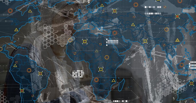 Businesswoman operating digital dashboard in high-tech room, with world map grid and data markers