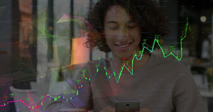 Smiling man with curls analyzing financial chart overlay at table in coffee shop, with smartphone