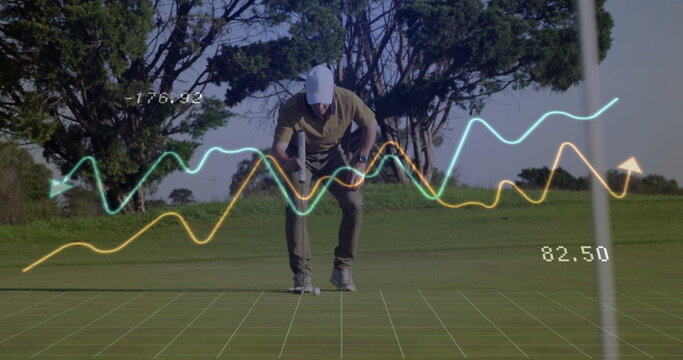 Bending male golfer placing golf ball near flagstick on putting green, with digital metrics overlay