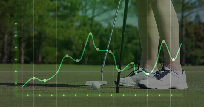 Golfer in golf shoes aligning putt on putting green, with ball, grid graph overlay, copy space - Powered by Adobe