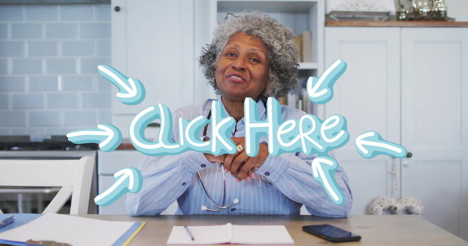 Reviewing documents, doctor wearing striped shirt using smartphone at kitchen desk with stethoscope - Powered by Adobe