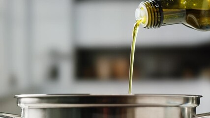 Pouring olive linen oil sunflower in different dishes close-up. Using in cooking for frying foods or as a salad dressing omega 3. Olive oil is popular supplement for meals and salads.  - Powered by Adobe