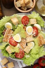 Delicious salad with croutons and ingredients on table, flat lay