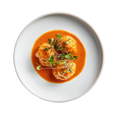 Delicious homemade dumplings in rich tomato sauce garnished with fresh herbs on a white plate on transparent background