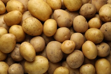 Fresh raw potatoes as background, top view