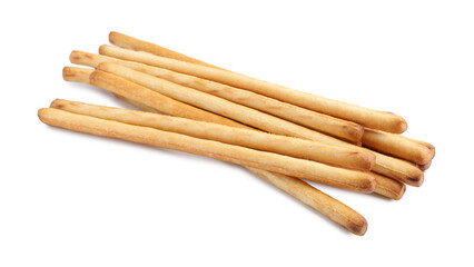 Many delicious grissini sticks isolated on white