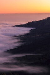 Fog at feet of mountain
